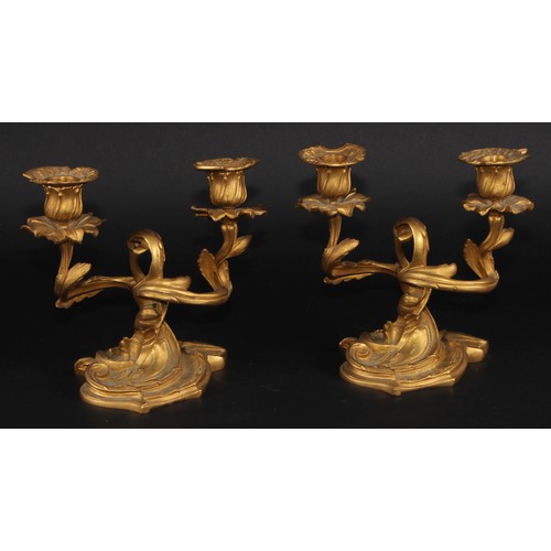 2163 - A pair of 19th century Rococo Revival gilt bronze two-light candelabra, cast throughout with scrolli... 