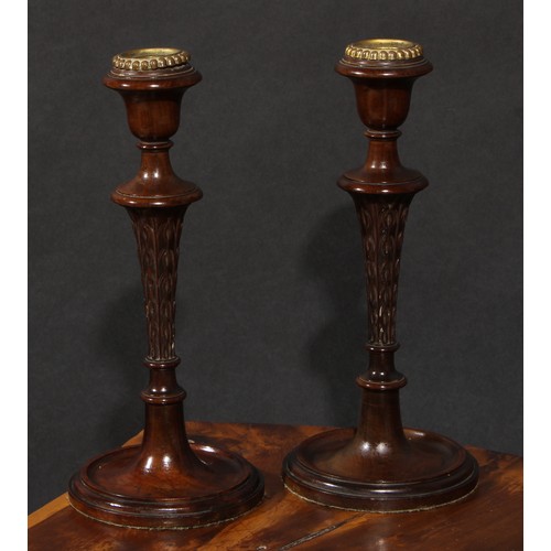 2054 - A pair of Adam Revival mahogany table candlesticks, campana sconces, carved tapered pillars, turned ... 