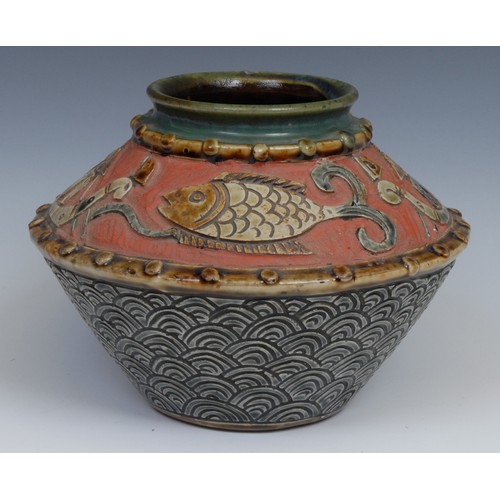 14 - A studio pottery vase, decorated in the typical Japanese manner with stylised fish and figures on bo... 