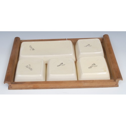 6 - A Clarice Cliff hors d'oeuvre set, comprising one rectangular and four square dishes, printed marks,... 