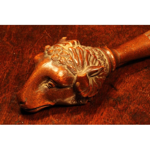 1105 - Nutcrackers - a Black Forest novelty screw-action nut cracker, carved as the head of a ram, lotus gr... 