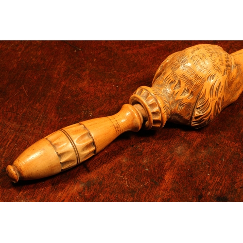 1104 - Nutcrackers - a Black Forest novelty screw-action nut cracker, carved as the head of a dog, lotus gr... 