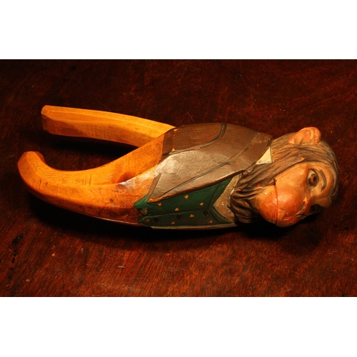 1089 - Nutcrackers - a Black Forest novelty lever-action nut cracker, carved and painted as a monkey, finel... 