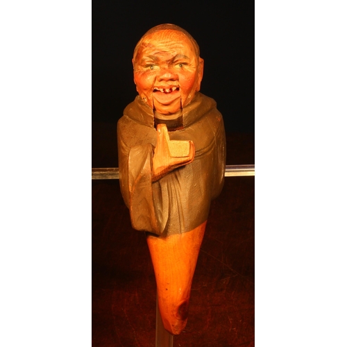 1088 - Nutcrackers - a Black Forest novelty lever-action nut cracker, carved and painted as a monk holding ... 