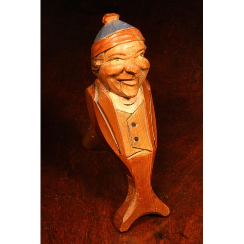 1081 - Nutcrackers - a Black Forest novelty lever-action nut cracker, carved and painted as a gentleman wea... 