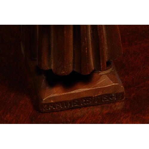 1112 - Nutcrackers - a Black Forest novelty table top lever-action nut cracker, carved as an elderly lady h... 