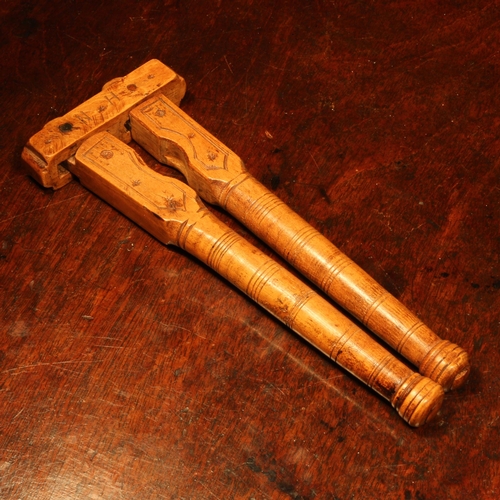 1130 - Nutcrackers - an 18th century boxwood lever-action nut cracker, constructed with independent levers,... 