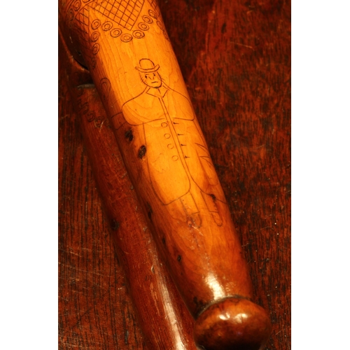 1140 - Nutcrackers - an 18th century yew wood crossover lever-action nut cracker, scrimshaw engraved with n... 