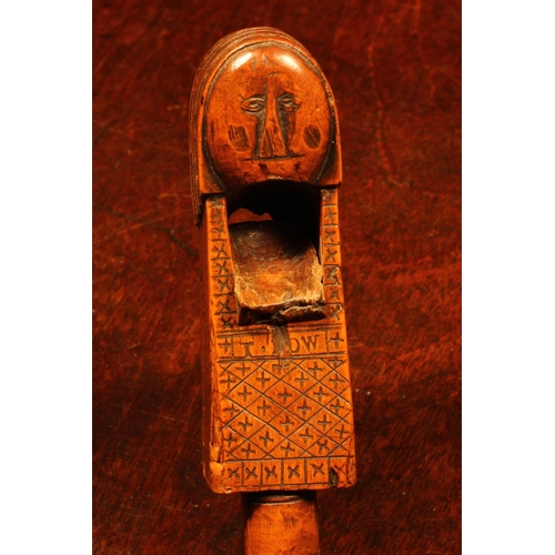 1064 - Nutcrackers - a 17th century boxwood figural lever-action nut cracker, as a stylised knight, his rud... 