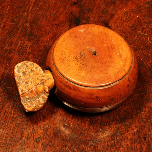 1152 - Nutcrackers - an early 19th century boxwood ring shaped screw-action pocket nut cracker, 6cm diam, c... 