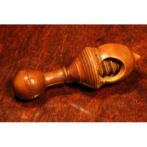 1147 - Nutcrackers - an early 19th century boxwood acorn shaped screw-action pocket nut cracker, 11cm long,... 