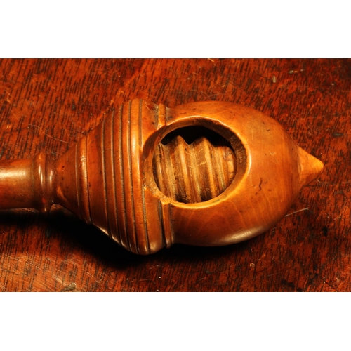 1147 - Nutcrackers - an early 19th century boxwood acorn shaped screw-action pocket nut cracker, 11cm long,... 