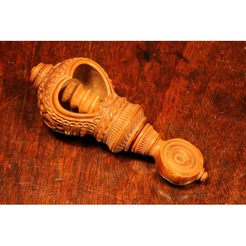 1070 - Nutcrackers - a 19th century boxwood screw-action nut cracker, heart shaped aperture, drilled and ch... 