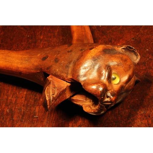 1095 - Nutcrackers - a Black Forest novelty lever-action nut cracker, carved as the head of a cat, glass ey... 