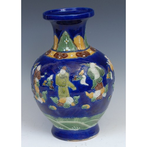 255 - A Chinese ovoid vase, in the manner of Wang Bing Rong, decorated in tones of green, brown and yellow... 