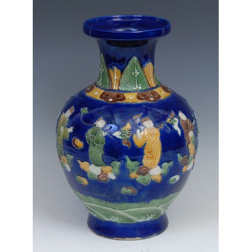 255 - A Chinese ovoid vase, in the manner of Wang Bing Rong, decorated in tones of green, brown and yellow... 