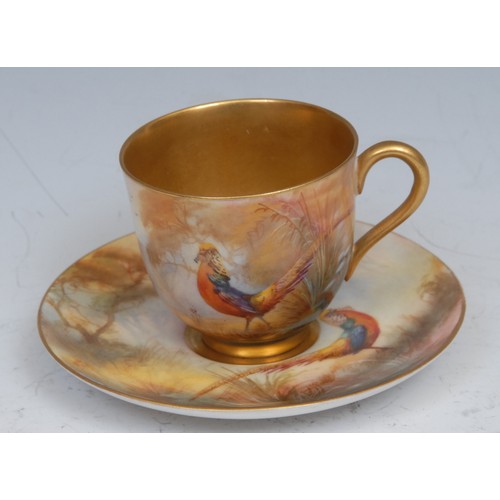 66 - A Royal Worcester cabinet cup and saucer, painted by Walter Sedgley, signed, with golden pheasant, g... 