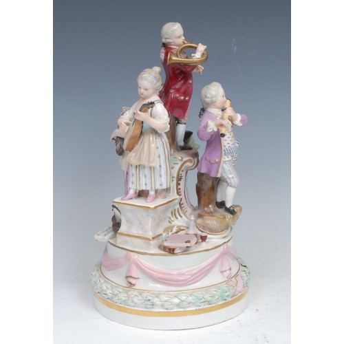 152 - A 19th century Meissen figure group centrepiece, as four musicians, each outward-facing standing on ... 