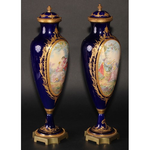 167 - A pair of French gilt metal mounted porcelain slender ovoid vases, painted in the manner of Sèvres w... 