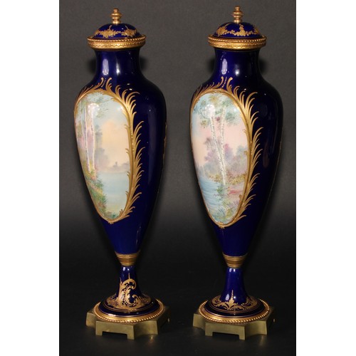 167 - A pair of French gilt metal mounted porcelain slender ovoid vases, painted in the manner of Sèvres w... 