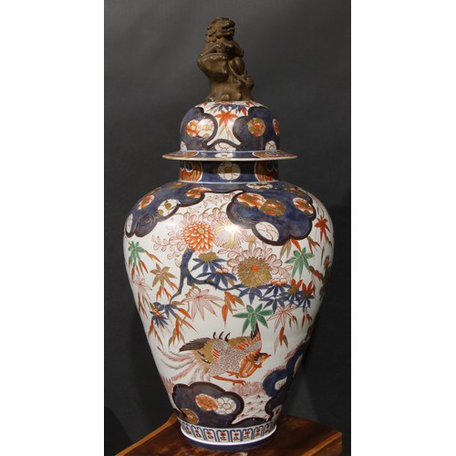 236 - A large Japanese ovoid jar, painted in the Chinese taste in the Imari palette with phoenix and flowe... 