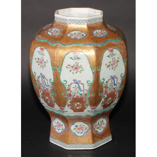 212 - A 19th century Chinese famille rose octagonal baluster vase, painted with baskets of flowers, gilt s... 