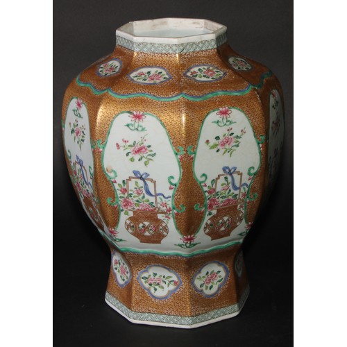 212 - A 19th century Chinese famille rose octagonal baluster vase, painted with baskets of flowers, gilt s... 