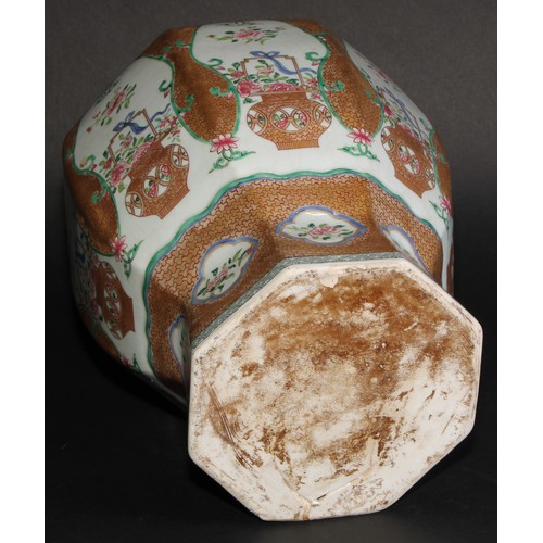 212 - A 19th century Chinese famille rose octagonal baluster vase, painted with baskets of flowers, gilt s... 
