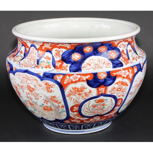 228 - A Japanese ovoid jardiniere, typically painted in the Imari palette, 29.5cm diameter, Meiji period