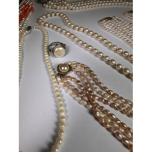 987 - A triple strand cultured pearl necklace; other cultured pearl necklaces and a ring (9)