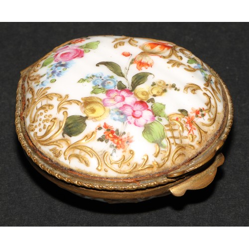 1183 - A Continental porcelain gilt metal mounted shell shaped snuff box, painted in polychrome with Deutsc... 