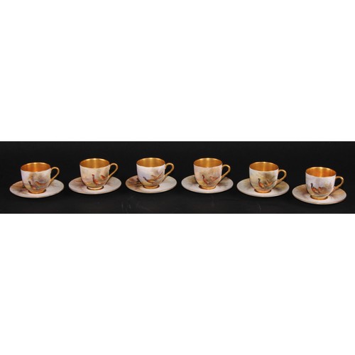 102 - A set of six Royal Worcester coffee cups and saucers, painted by James Stinton, signed, with pheasan... 