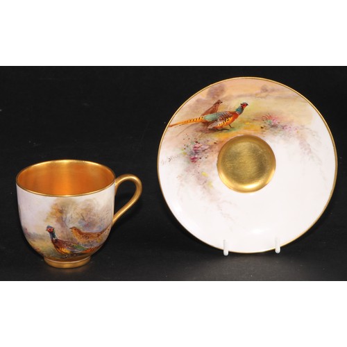 102 - A set of six Royal Worcester coffee cups and saucers, painted by James Stinton, signed, with pheasan... 