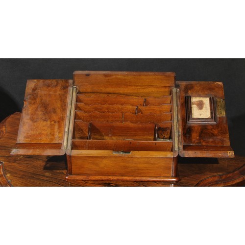 2153 - A Victorian walnut table-top desk box, hinged sloping front with twin covers enclosing an interior f... 