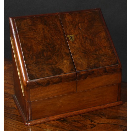 2153 - A Victorian walnut table-top desk box, hinged sloping front with twin covers enclosing an interior f... 