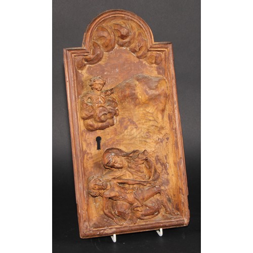 2099 - A South European cedar tabernacle door, carved with the Pieta, 38cm x 20cm, 18th/19th century