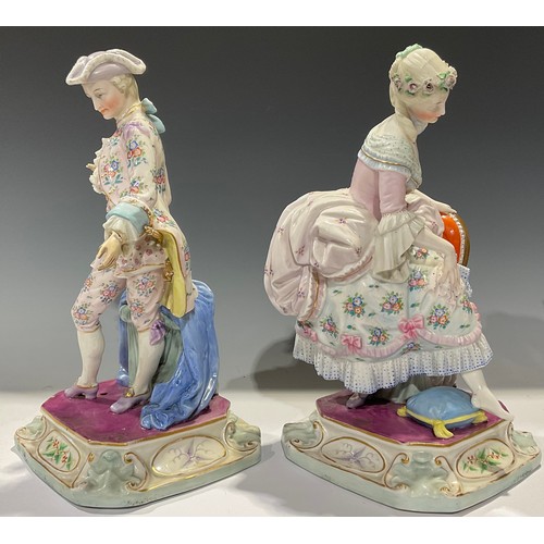 165 - A pair of Continental porcelain figures, of a gallant and his beau, each finely dressed in the 18th ... 