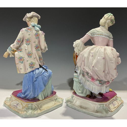 165 - A pair of Continental porcelain figures, of a gallant and his beau, each finely dressed in the 18th ... 