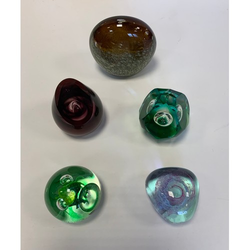 9 - Glass paperweights - a Caithness glass paperweight, ‘Reincarnation’, in green glass, limited edition... 