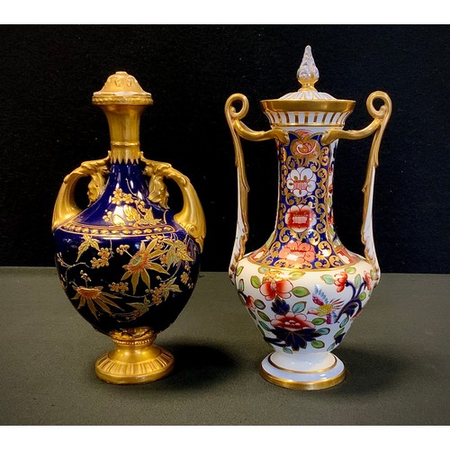 13 - A Copeland Spode Imari patterned twin handled vase, 22cm high; Royal Worcester blue and gilt twin ha... 