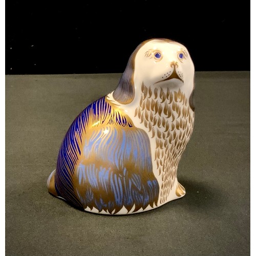 23 - A Royal Crown Derby paperweight, Seated Spaniel, gold stopper.