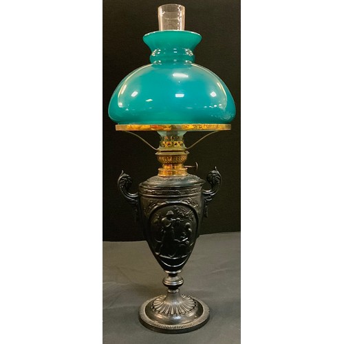35 - A 19th century cast iron oil lamp, painted black, 28cm high