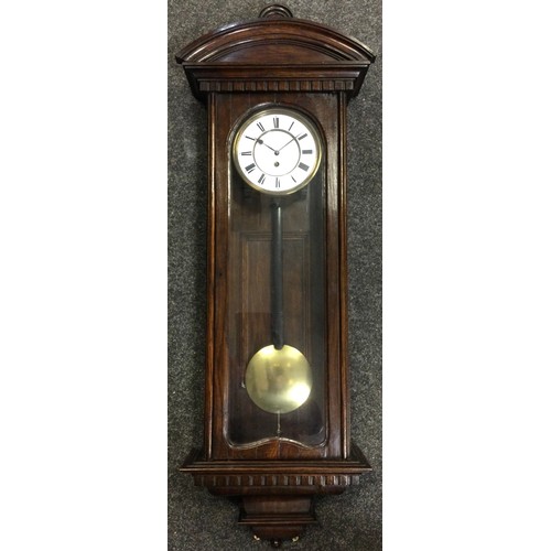 39 - An oak cased Vienna wall clock, single weight Viennese movement, white enamelled dial with black Rom... 