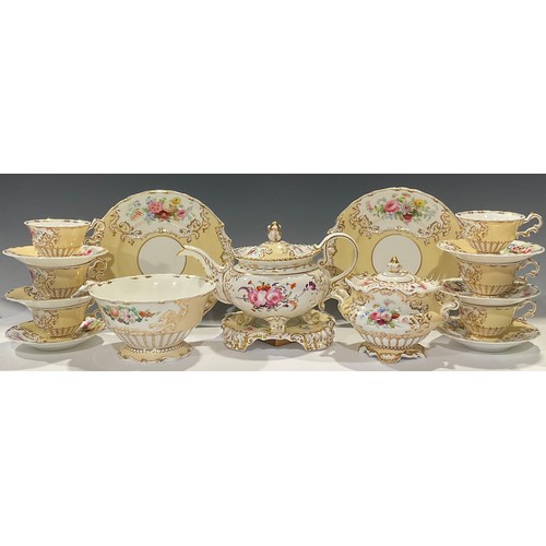 33 - A Copeland and Garrett Rococo style tea service, painted with bright summer blooms on a corn yellow ... 