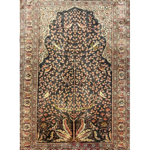 57 - A Persian Isfahan style silk wool mix carpet, knotted ‘Tree of life’ pattern to central field, styli... 