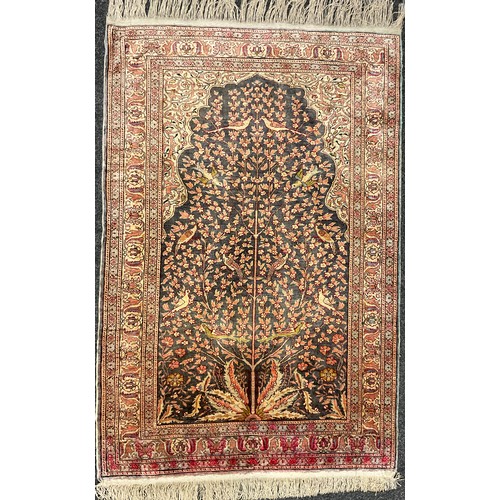 57 - A Persian Isfahan style silk wool mix carpet, knotted ‘Tree of life’ pattern to central field, styli... 