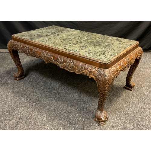 63 - An Oriental Chinoiserie carved walnut ‘Opium’ or coffee table, inset green marble rounded rectangula... 