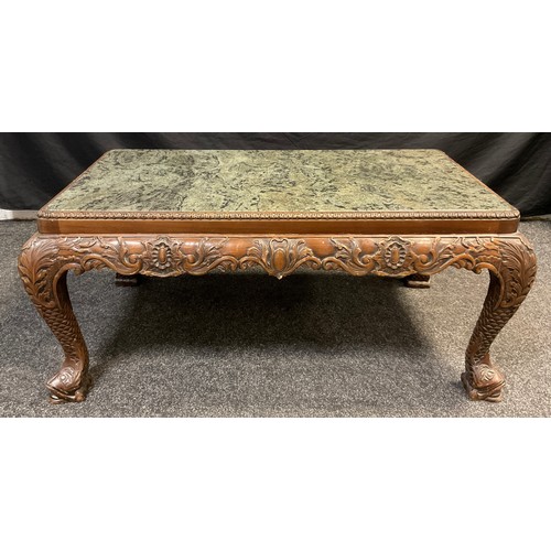 63 - An Oriental Chinoiserie carved walnut ‘Opium’ or coffee table, inset green marble rounded rectangula... 