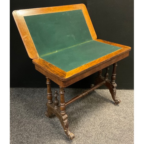 66 - A Victorian walnut and burr walnut card table, rounded rectangular top, turned supports, ceramic cas... 