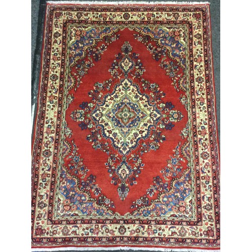 76 - A Central Persian Sarouk woollen rug / carpet, central diamond-shaped medallion, within a field of s... 